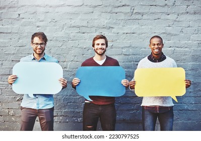 Theyve got some thoughts to share. Portrait of a group of young men holding speech bubbles against a brick wall. - Shutterstock ID 2230797525