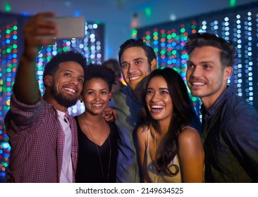 Theyve Made It A Night To Remember. Cropped Shot Of A Group Of Friends Taking A Selfie While Partying In A Club.