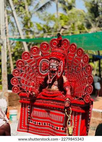 Theyyam is a popular ritualistic art form that originated in the northern part of Kerala state in India. It is a form of worship that combines dance, music