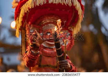 Theyyam, a traditional ritualistic dance form from Kerala, India.