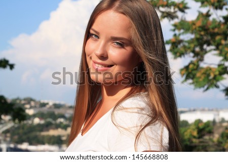 Thick Beautiful Teen Girl With Long Hair Against The Blue Sky With Clouds Thick Beautiful Teen Girl With Long Hair Against The Blue Sky With Clouds
