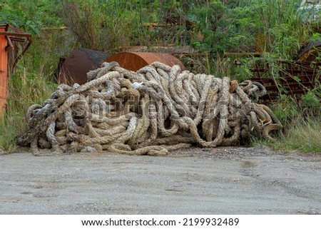 Thick braided rope. Texture of a braided rope. Fishing net
