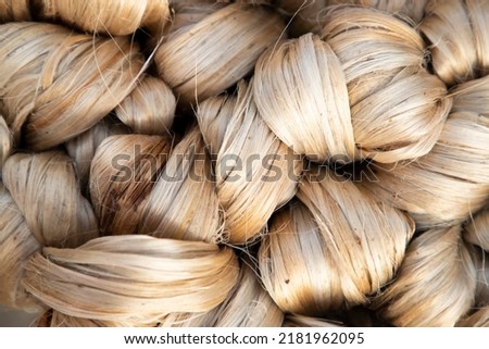 thick brown bundle of raw jute fiber Texture Background