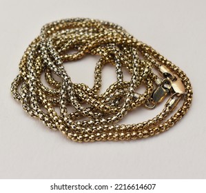 Thick Chunky Chain Necklace On A Beige Background, Old Gold Vintage Jewelry