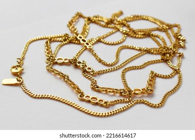 Thick Chunky Chain Necklace On A Beige Background, Old Gold Vintage Jewelry