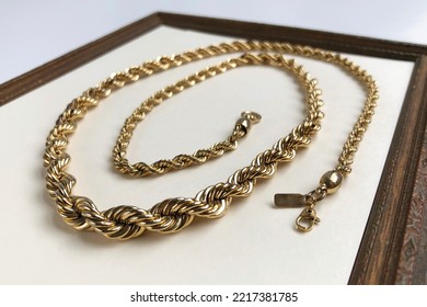 Thick Chunky Chain Necklace On A Beige Background, Old Gold Vintage Jewelry