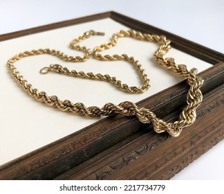 Thick Chunky Chain Necklace On A Beige Background, Old Gold Vintage Jewelry