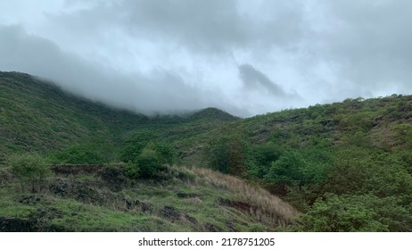 Thick Clouds Over Lush Green Hills