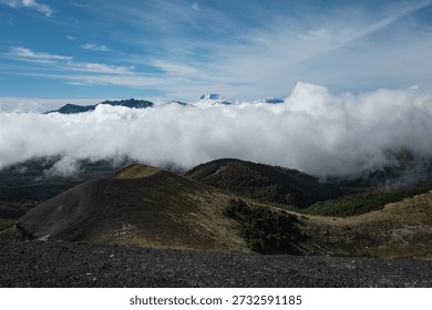 Thick Clouds Rolling Over Forested Slopes and Volcanic Patagonia Ridge