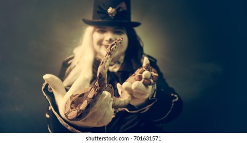 Thick crazy actor in white makeup with a snake.