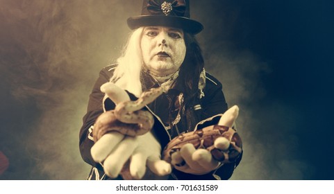 Thick crazy actor in white makeup with a snake.