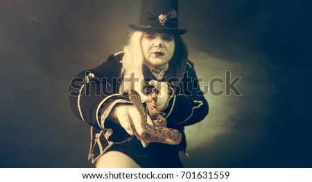 Thick crazy actor in white makeup with a snake.