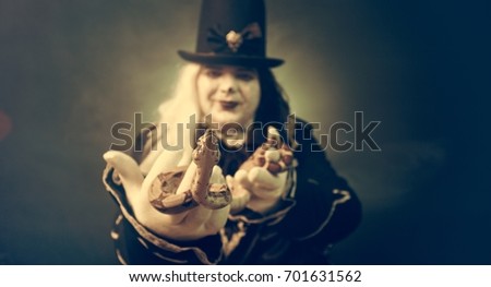 Thick crazy actor in white makeup with a snake.