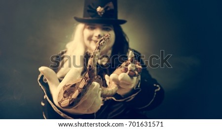 Thick crazy actor in white makeup with a snake.