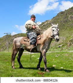 Thick dirty man on horseback. What looks like the Sancho Panza