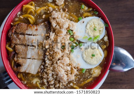 thick egg noodles with fried pork belly or also known as lechon lomi 