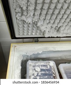 Thick Ice Built Up On Deep Freezer Lid And Rubber Gasket.