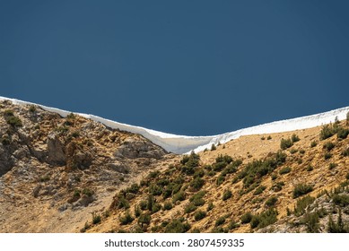 Thick Layer Of Snow Crests Hillside Over Charlotte Lake In Kings Canyon National Park