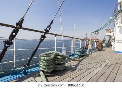 Thick ropes on a wooden sailing ship floor