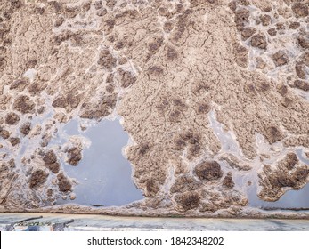Thick sludge in finnishing rotting tank. Methane bubbling wastewater on the water surface in detail