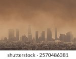 Thick smoke blankets the skyline as multiple wildfires rage across Los Angeles, California, creating a dramatic and ominous scene.