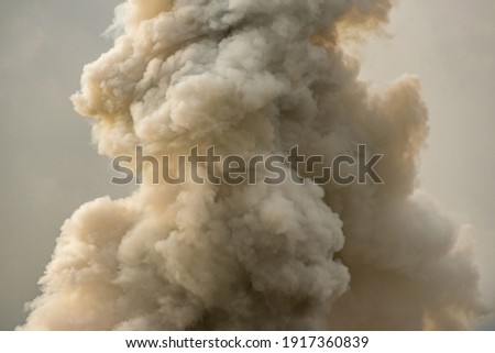 Thick smoke caused by heavy combustion.