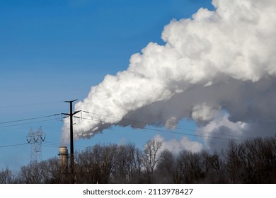 Thick Smoke Rising From The Chimney Of A Power Plant