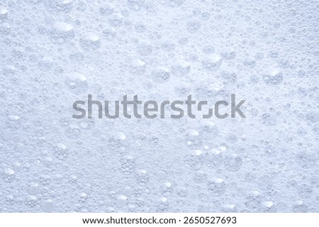 Thick soap foam with bubbles.