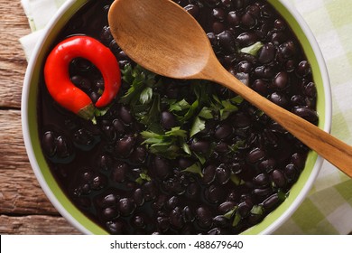 Thick Soup Of Black Bean With Chilli Peppers Close Up In A Bowl On The Table. Horizontal View From Above
