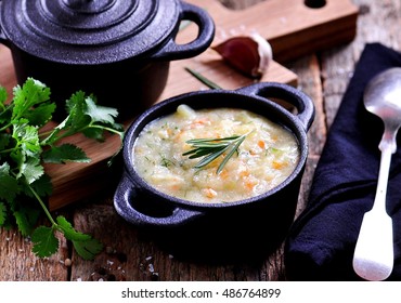 Thick Soup Of Corn Grits With Potatoes, Carrots, Garlic, Dill And Coriander