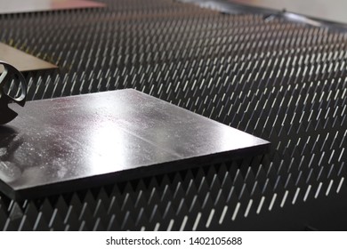 A Thick Steel Plate On Machine , Ready For Processing Or Cutting  ; Industrial Background ;close Up