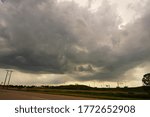 Thick thunder, lighting, and rain storm clouds traveling over fond du lac, wisconsin. 