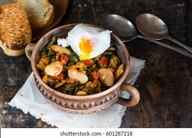 Thick Vegetarian Kale And Bean Soup Or Stew With Toast And Poached Egg