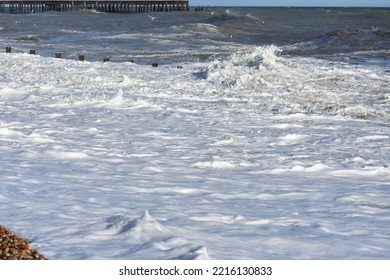 Thick White Sea Foam On The Shore