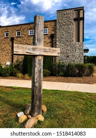 Thick Wooden Cross Outside A Church