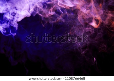 Thickpink and purple smoke on a black isolated background. Background from the smoke of vape
