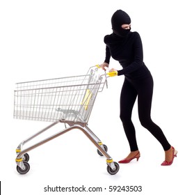 thief in black clothes and balaclava with shopping cart