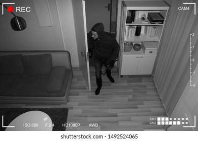 Thief With Crowbar Entering Into House Scene Through CCTV Camera