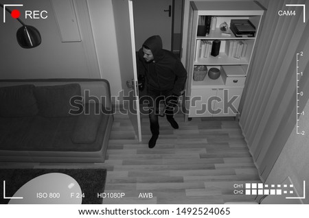 Thief With Crowbar Entering Into House Scene Through CCTV Camera