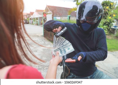 Thief With Gun On Motorcycle Stealing Money From Woman On Street (theft Concept)
