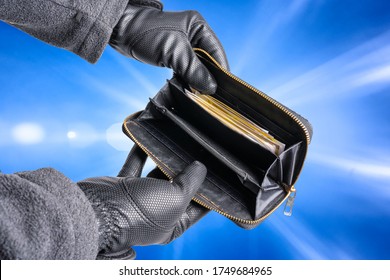 A Thief Has Stolen A Wallet And Is Searching It