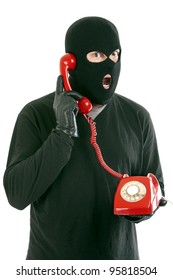 Thief With Mask Red With A Phone Call