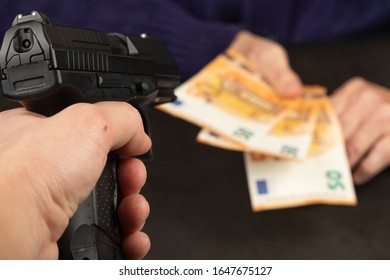 Thief pointing handgun on a elderly woman - Shutterstock ID 1647675127