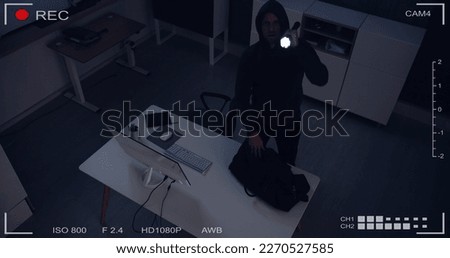 Thief Stealing Computer From Office At Night