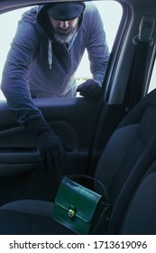 Thief Stealing Handbag From Car