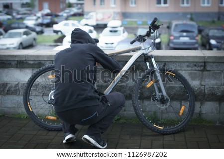 The thief steals a bicycle. thief