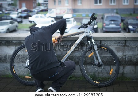 The thief steals a bicycle. thief
