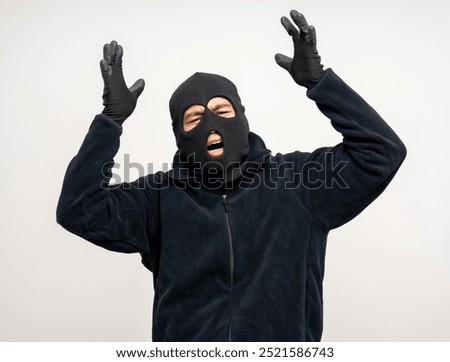 Thief in uniform black jacket various pose on isolated background. The Robber terrorism criminal escapes with balaclava and crowbar entering a house for stealing Housebreak
