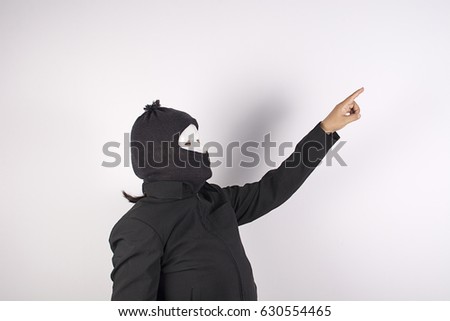 Thief woman standing pointing
