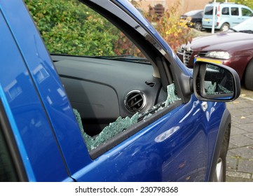 Thiefs Have Broken A Car Window To Steel Items Inside